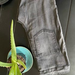 Size 4 never been worn dark/washed black jeans with rip in the knee